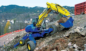 pelleteuse midi / sur pneus / Tier 3 / pour chantier de construction
