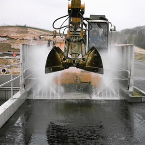 système de lavage pour engins de construction