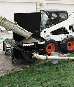 pompe à béton pour chargeuse / pour chantier