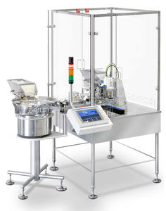 remplisseuse / boucheuse pour produits pharmaceutiques