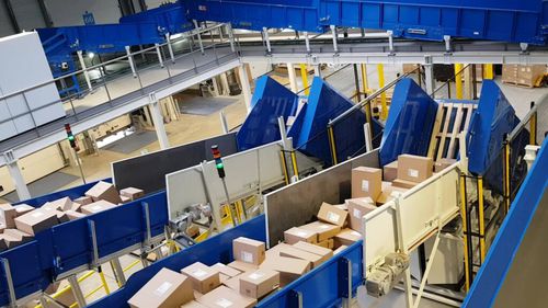 Système de déchargement pour colis - U-care P - ALFI TECHNOLOGIES - pour palettes / automatique