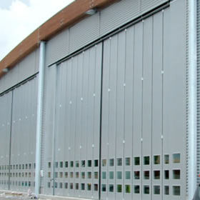 Porte pliante - PL 10000 MOT - SACIL HLB - de hangar / industrielle