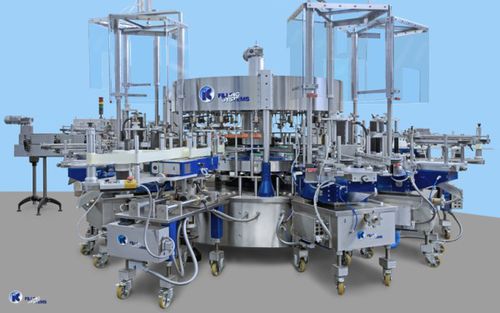 Machine d'étiquetage automatique - IC Filling Systems LTD - pour bouteilles / par colle froide / par colle thermofusible