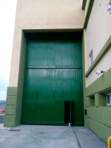 Porte coulissante verticale - Talleres Alfa Torres - en métal / industrielle / pour l'intérieur