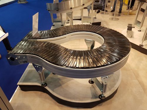 Convoyeur à bande - AmbaVeyor - AmbaFlex Spiral Conveyor Solutions - à rouleaux / horizontal / courbe
