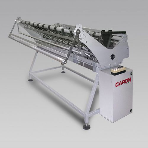 Alimentateur pondéral - PHOENIX - Caron Technology - pour la découpe / de tissus / automatisé