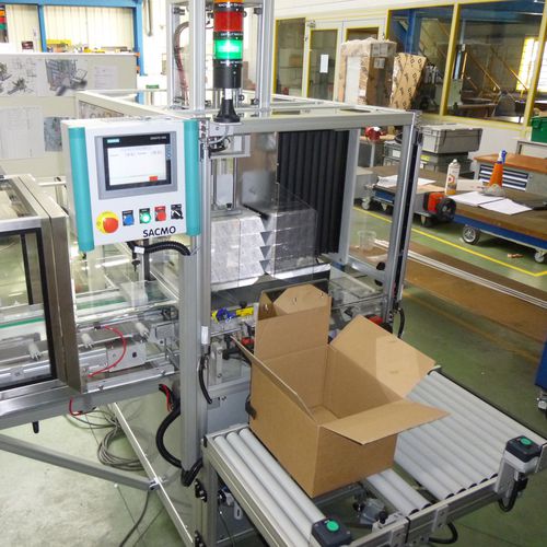 Encaisseuse latérale - SACMO - semi-automatique / de paquets / de cartons