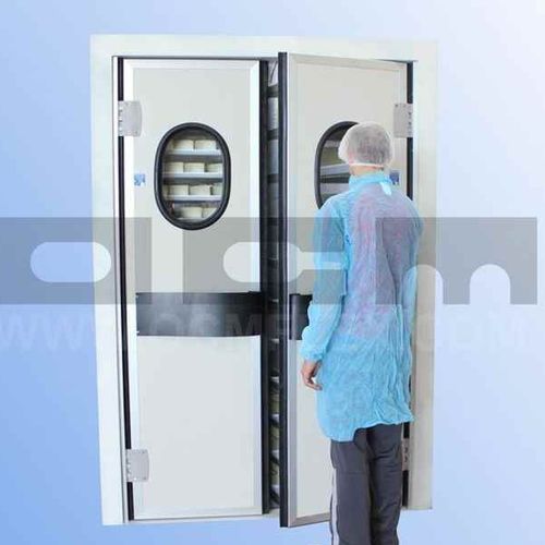 Porte battante - OCM Industrial Doors - en acier inoxydable / en polyéthylène / pour chambre froide