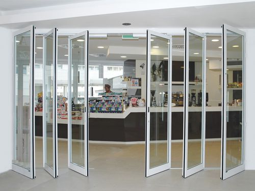 Porte coulissante - TSA T.O.S. 4 + 2 - Ponzi - battante / en verre / pour commerce