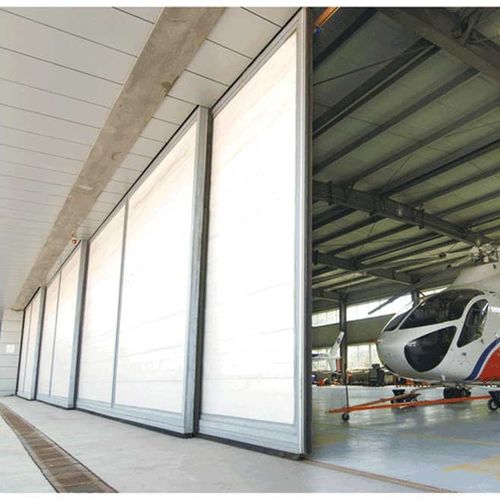 Porte de hangar - YUOU (LUOYANG) DOORS AND WINDOWS TECHNOLOGY CO., LTD. - coulissante / en acier / en acier galvanisé