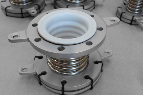 Compensateur de dilatation en métal - Macoga, S.A - en PTFE / rond / à bride