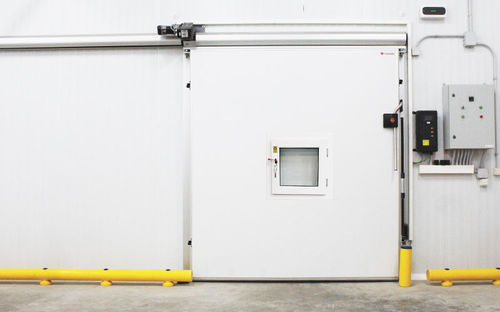 Porte coulissante - Kavidoors - en acier inoxydable / en aluminium / en acier