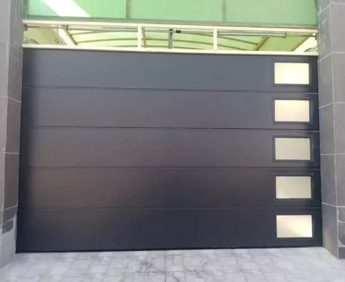 Porte coulissante - BRDECO - sectionnelle / en acier galvanisé / pour l'intérieur
