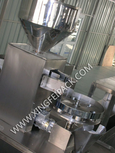 Doseur de granulés - Shanghai Xingfei Packaging Machinery Co., Ltd. - volumétrique / automatique / à plateau tournant