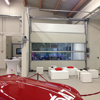 Porte sectionnelle - Moreschi Chiusure Industriali S.r.l. - en aluminium / vitrée / industrielle