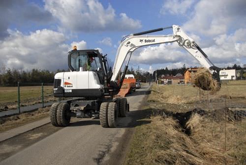 Pelleteuse midi - E55W - BOBCAT - sur pneus / Tier 4 intermédiaire / pour chantier de construction