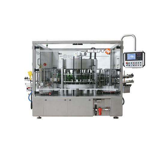 Machine d'étiquetage automatique - TORNADO W - HEUFT SYSTEMTECHNIK - pour bouteilles / pour l'industrie de la boisson / par colle thermofusible