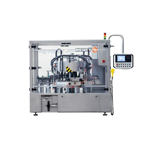 Machine d'étiquetage automatique - TORNADO R - HEUFT SYSTEMTECHNIK - pour bouteilles / wrap-around / pour l'industrie de la boisson