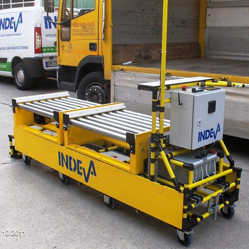 Véhicule autoguidé de chargement - Scaglia Indeva - de déchargement / pour charges lourdes / à rouleaux motorisés