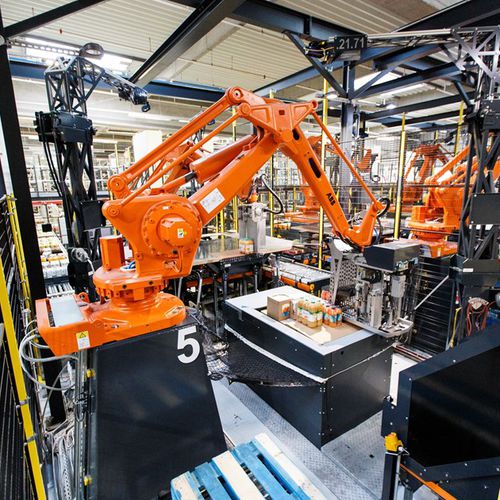 Système de palettisation robotisé - VANDERLANDE - de manutention / pour caisses / automatique