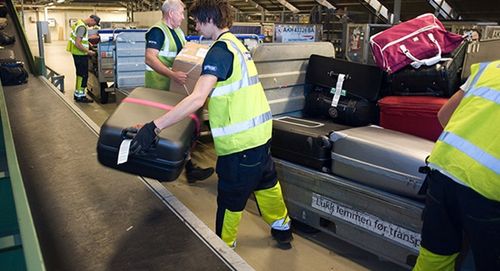 Système de déchargement de bagages - VANDERLANDE