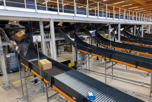 Convoyeur à bande - .M - VANDERLANDE - à rouleaux / incliné / de transport