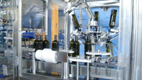 Remplisseuse / boucheuse pour huile d'olive - MFC - PMR System Group - à pince / pour bouteilles / automatique