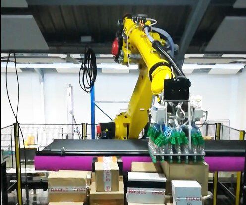 Dépalettiseur robotisé - Fives Cinetic SAS - en bouteille / pour l'industrie / de sacs